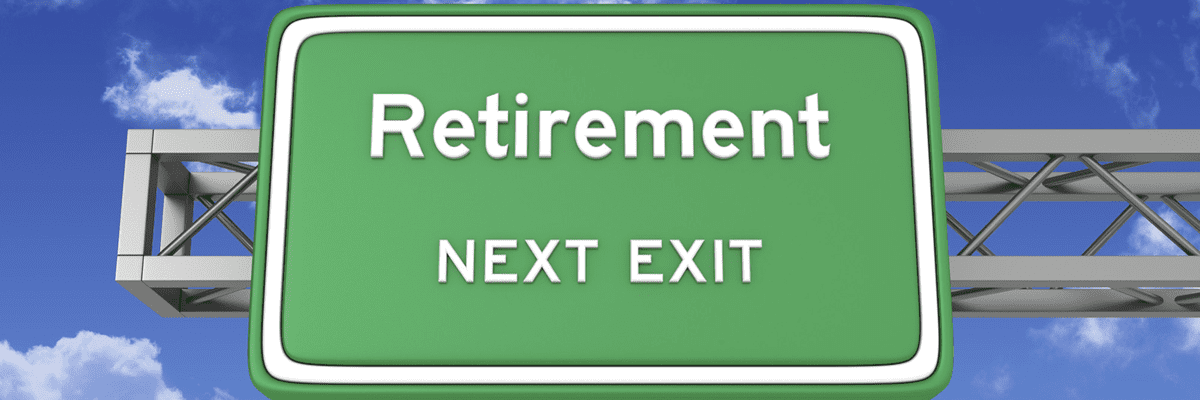 Green street sign in front of a partly cloudy blue sky reading "Retirement next exit"